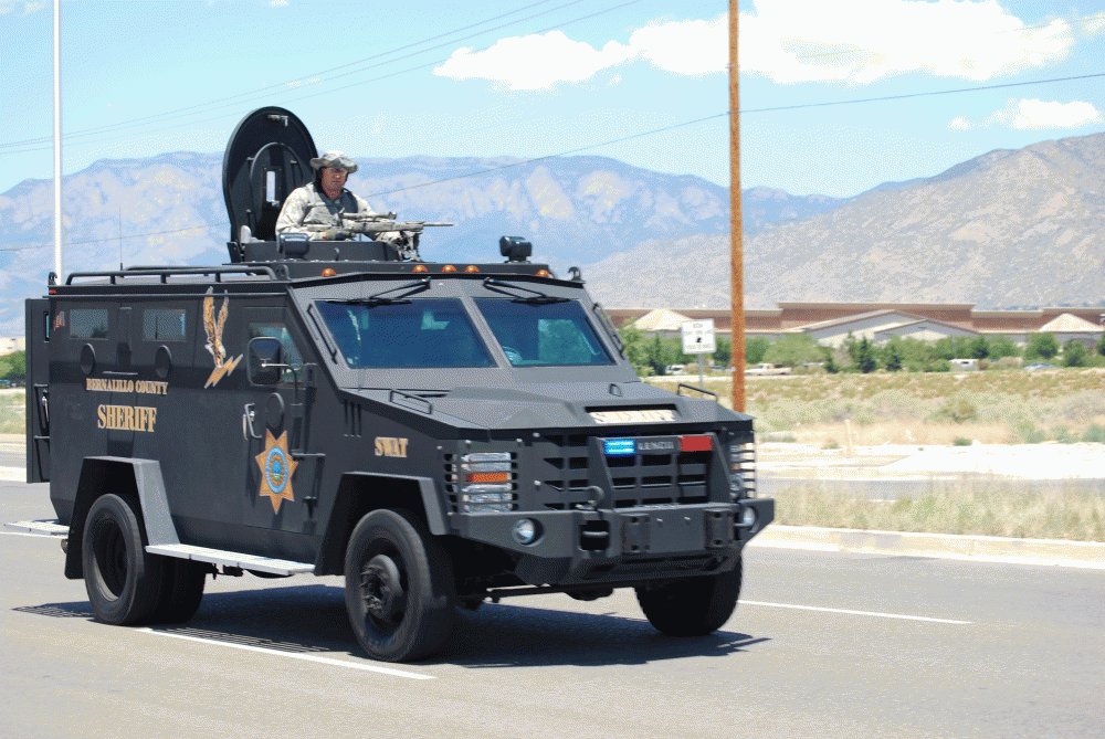 	Members of the Bernalillo County Sheriff’s Department SWAT team arrive at the crime scene near Eubank Boulevard and Gibson Avenue. 