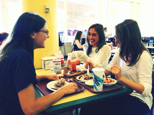 Seniors Kayti Faustini, Sharon Young and Danielle Antony enjoy a meal at the Haines Food Court during their break. 