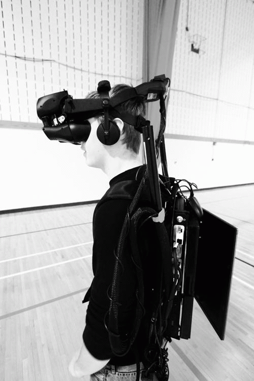 Former student Joshua Kisling tests the virtual reality study of the HIVE, Miami’s Huge Interactive Virtual Environment located in Phillips Hall. 