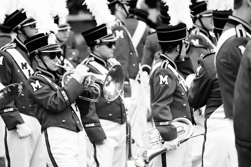 First-year Amy Roth plays her mellophone near Millett Hall before taking the field at a football game. 