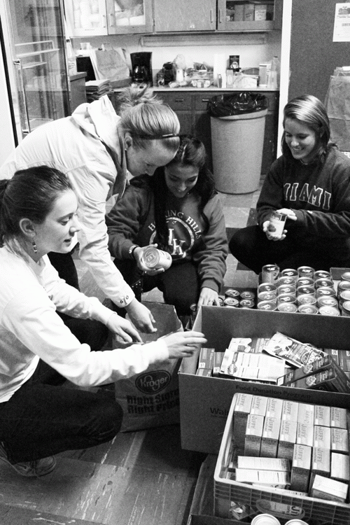 Students Ashley Charles, Courtney Frydryk, Shawnee Waters, and Claire Cawley volunteer at the Oxford Community Choice Pantry. 