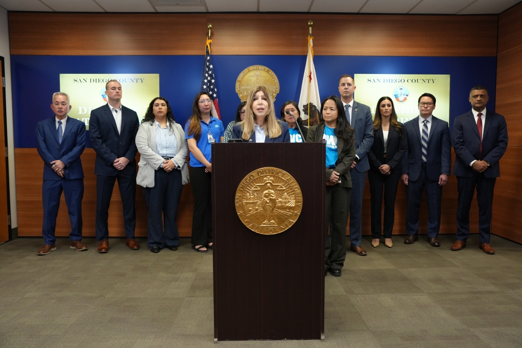 Photo of DA Summer Stephan at press conference announcing human trafficking and wage theft charges today against two defendants who were taking advantage of the immigration status of their workers, forcing them to work around the clock without the pay required under California laws.