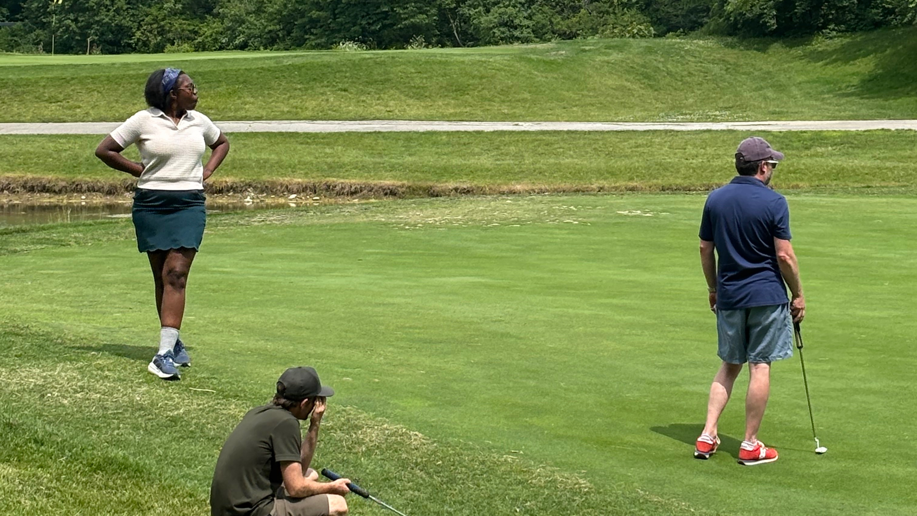 Sacha pretending she knows how to golf.