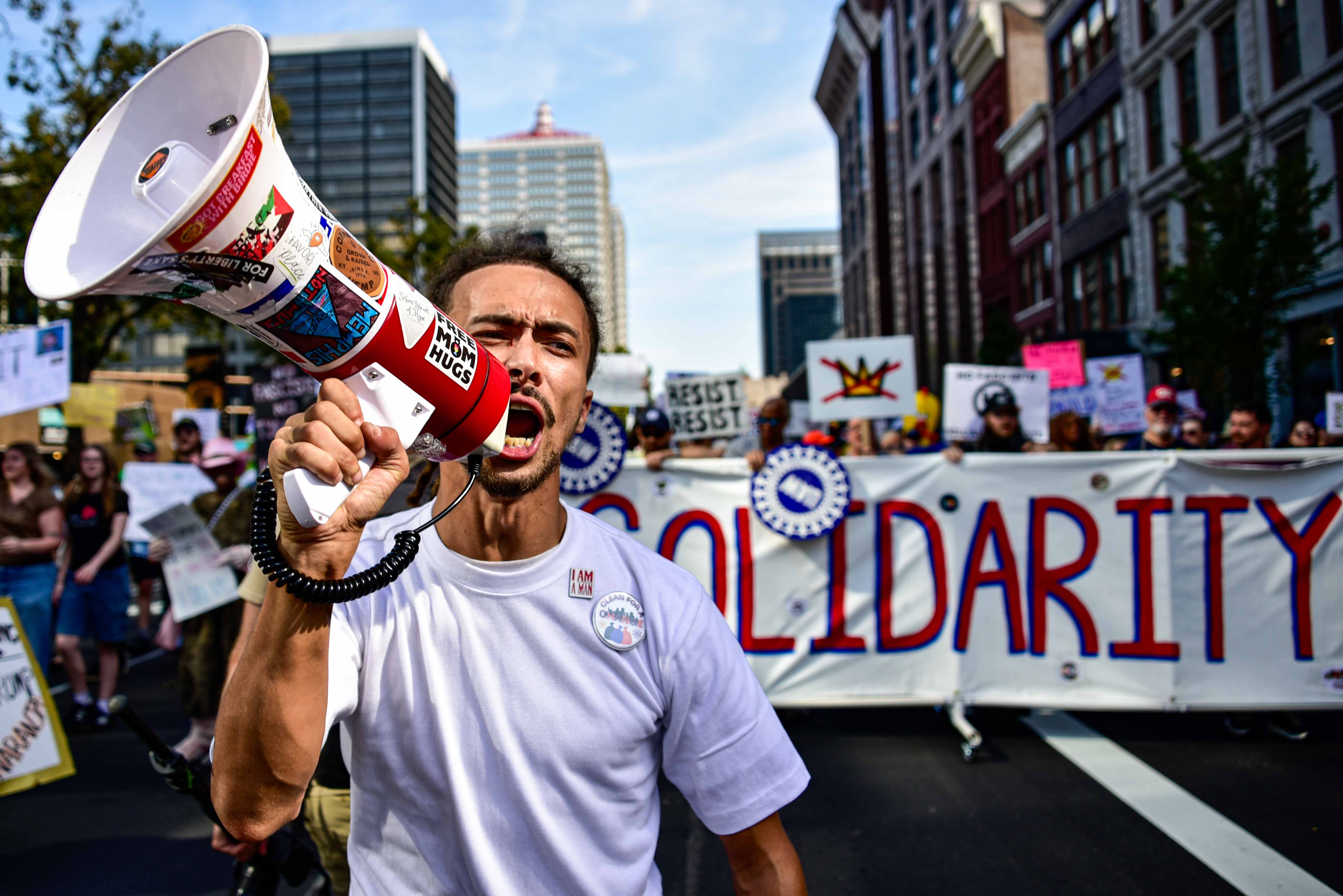 Robbey Taylor leads the 'No Kings' protest through downtown Louisville. (LPM, 2025)