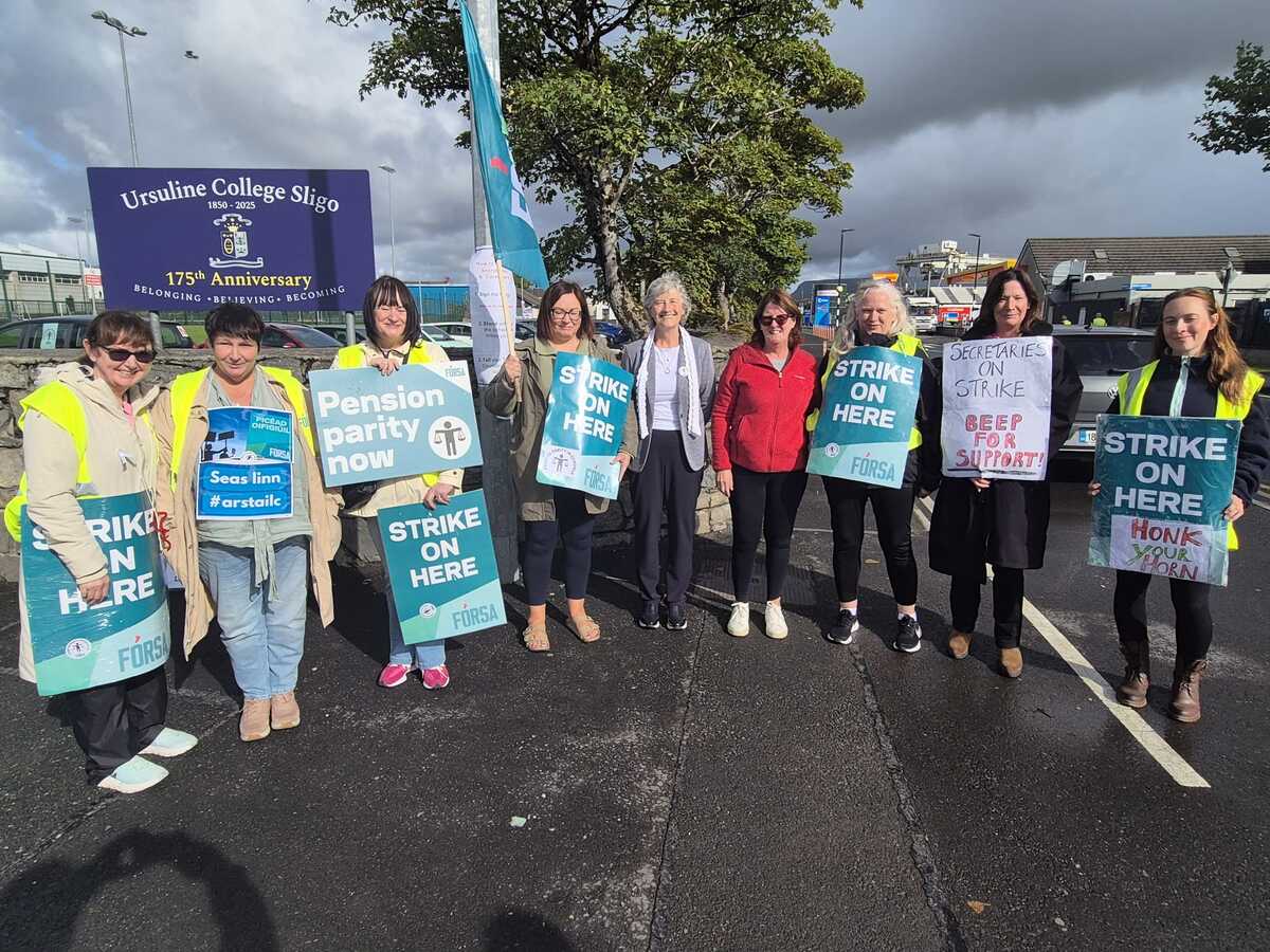 Catherine Connolly joins school secretaries and caretakers on the picket line in Sligo