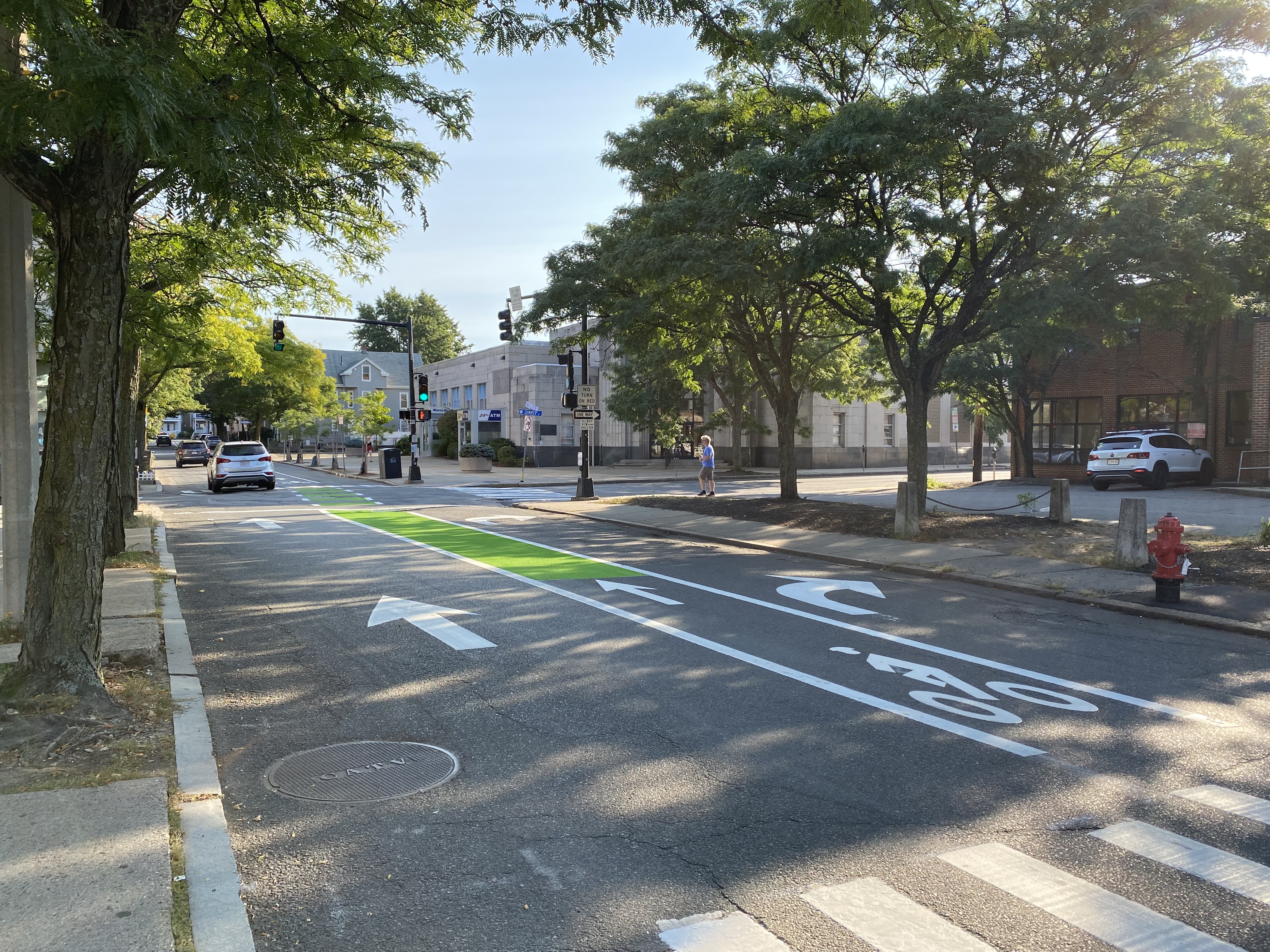 Bright green paint along bike lane on Russell Street outside Davis Square