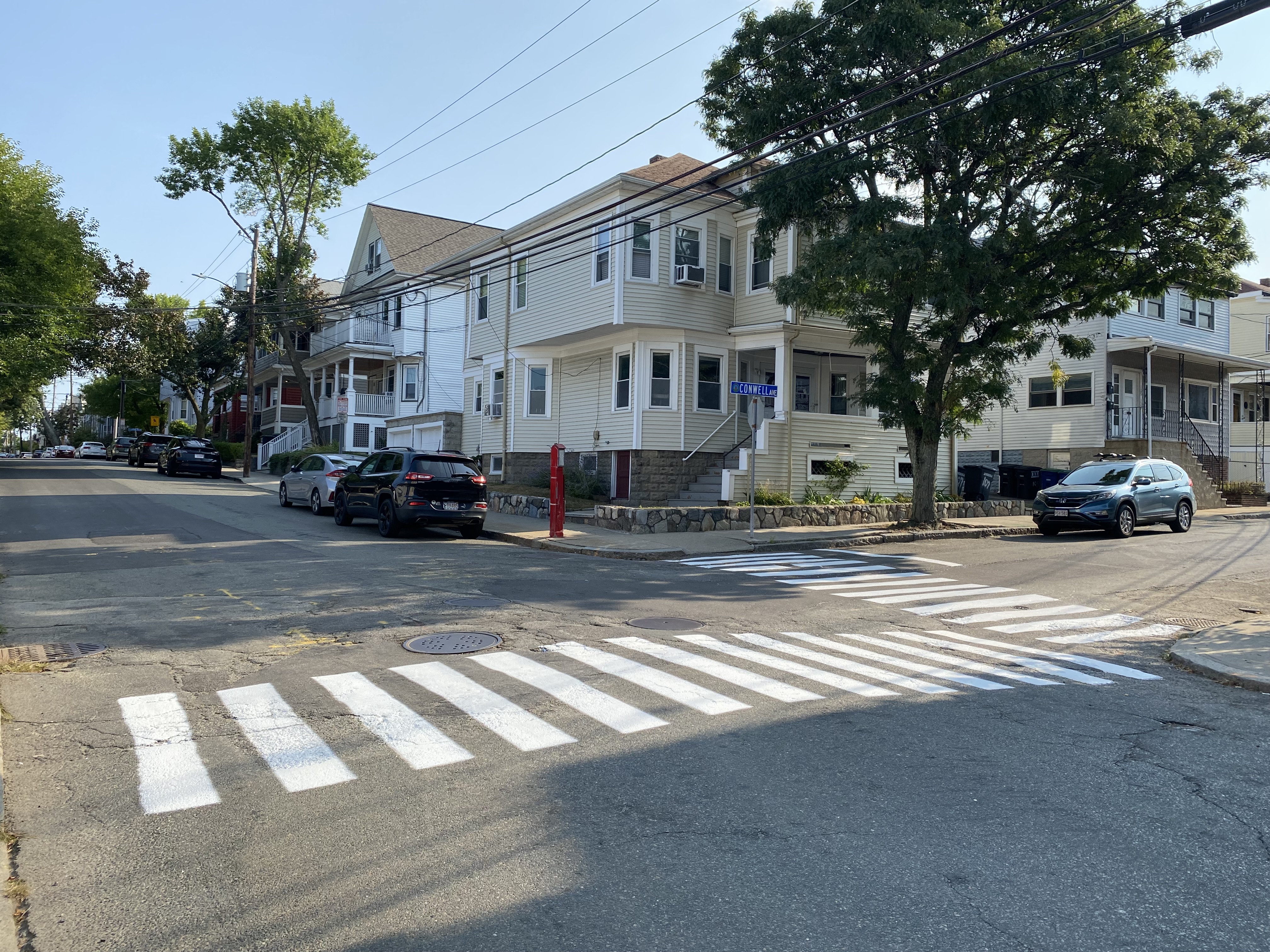 Two painted crosswalks at the intersection of Conwell Ave. and North St., a low traffic residential neighborhood.
