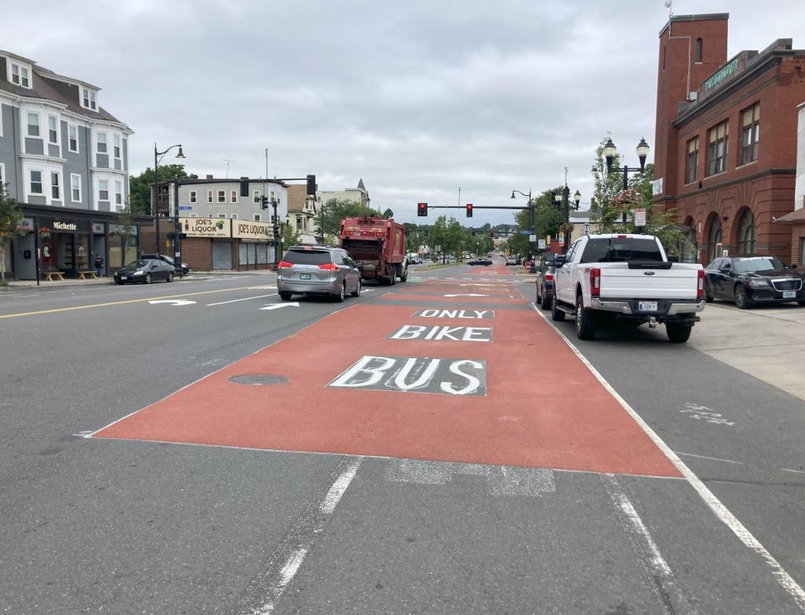 Red painted “bus-only” lane surrounded by traffic on Broadway
