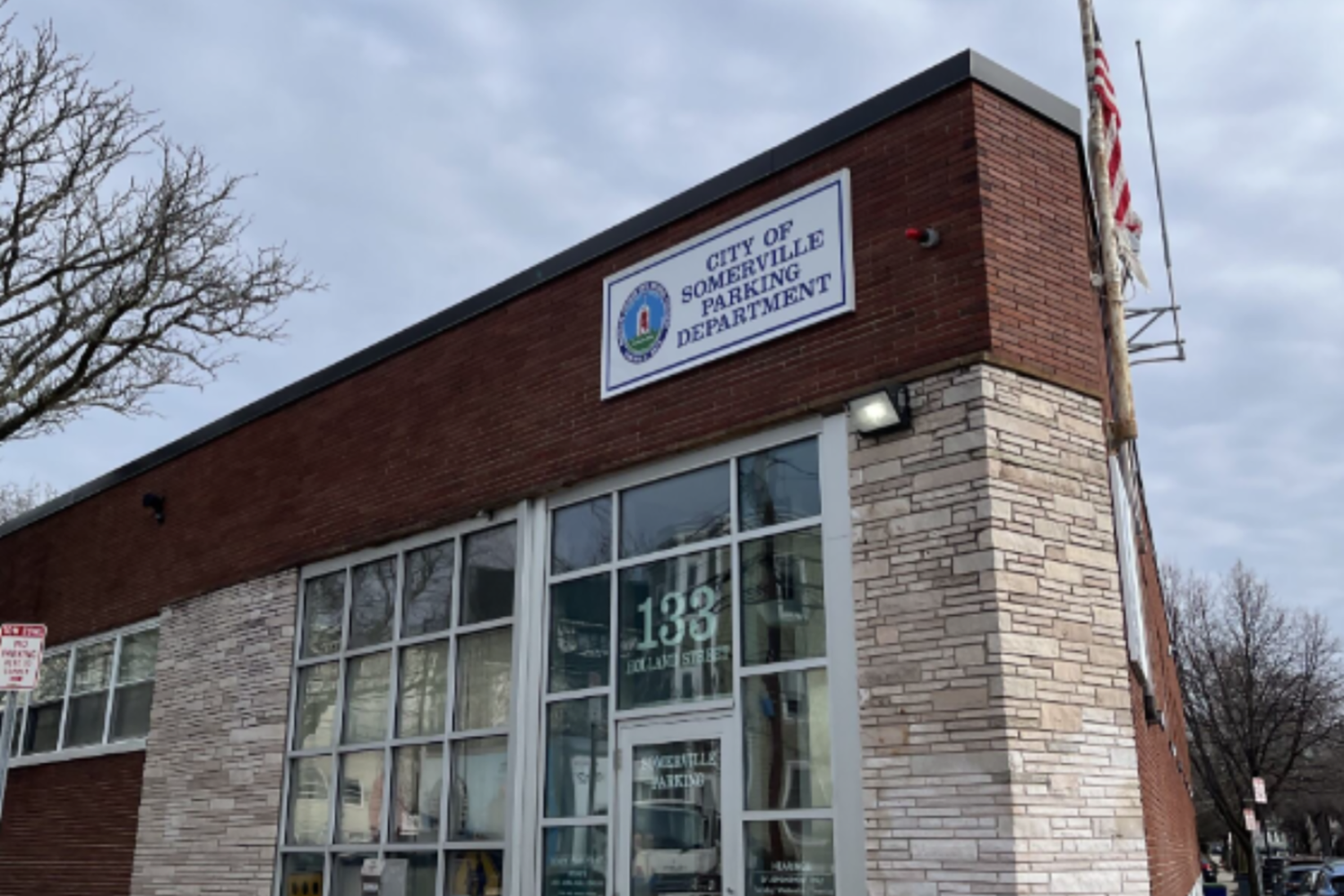Exterior photo of the Somerville parking office, taken from the street. 