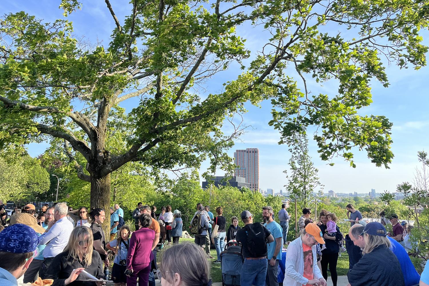 A crowd of Somerville residents gathered outdoors on a spring day at Slice of the City. 