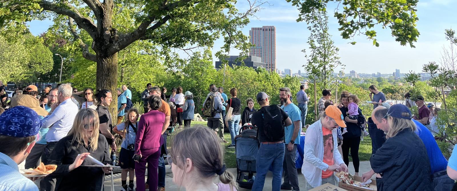 A gathered crowd at Slice of the City in a park in Somerville. 