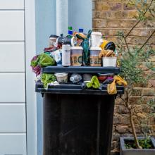 Overflowing recycling bins