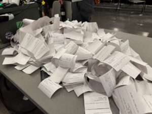 DC34 Lonely hackers club meshtastic printout pile