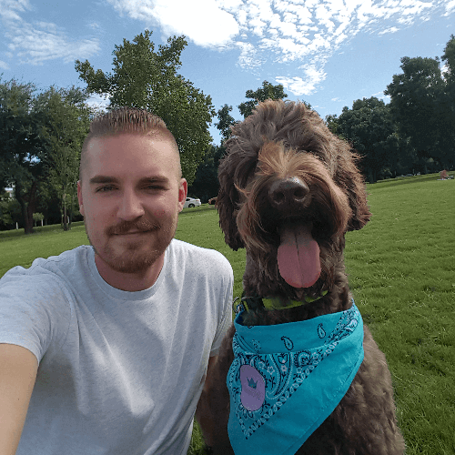 Shane Burkhart with his dog, Yogi.