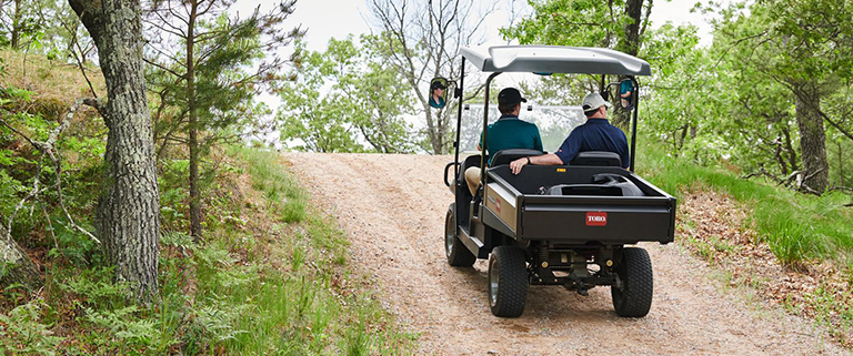 Toro Workman GTX driving on gravel road