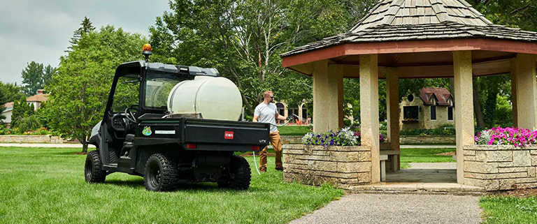 Toro Workman UTX hauling tanks of weed killer