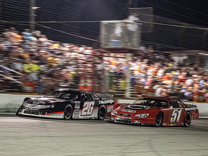 Bubba Pollard (26) battles Stephen Nasse during the Baby Rattler 125 on Saturday night at South Alabama Speedway. (Jason Reasin Photo) Bubba Pollard (26) battles Stephen Nasse during the Baby Rattler 125 on Saturday night at South Alabama Speedway. (Jason Reasin Photo)