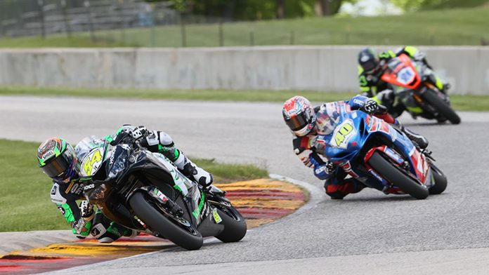 Richie Escalante (54) won his first career Supersport race after Sean Dylan Kelly (40) crashed out of their battle. Brandon Paasch (21) finished second. (Brian J. Nelson Photo) Richie Escalante (54) won his first career Supersport race after Sean Dylan Kelly (40) crashed out of their battle. Brandon Paasch (21) finished second. (Brian J. Nelson Photo)