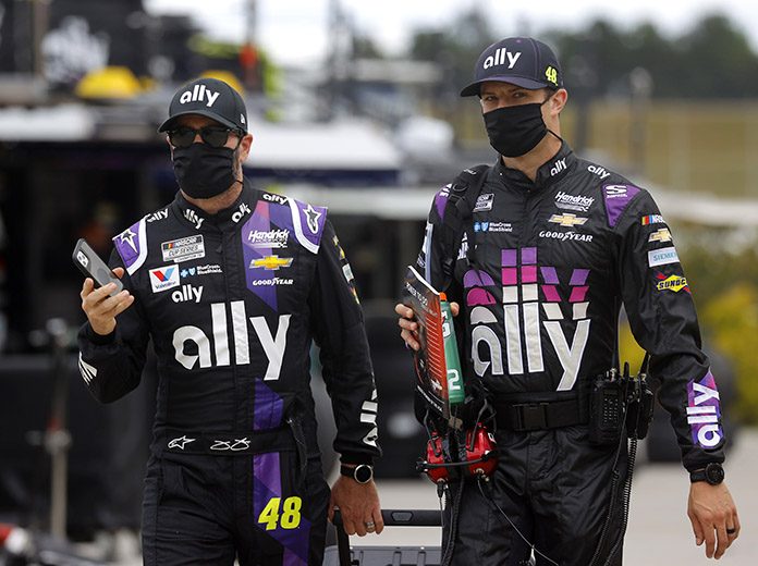 Jimmie Johnson and crew chief Cliff Daniels walk to the grid prior to the NASCAR Cup Series Folds of Honor QuikTrip 500 at Atlanta Motor Speedway on June 7. Johnson will sit out Sunday's race at Indianapolis Motor Speedway after being diagnosed with COVID-19. (Chris Graythen/Getty Images Photo) Jimmie Johnson and crew chief Cliff Daniels walk to the grid prior to the NASCAR Cup Series Folds of Honor QuikTrip 500 at Atlanta Motor Speedway on June 7. Johnson will sit out Sunday's race at Indianapolis Motor Speedway after being diagnosed with COVID-19. (Chris Graythen/Getty Images Photo)