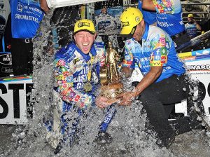 Justin Ashley gets an ice bath after winning his first NHRA Top Fuel event Saturday at Lucas Oil Raceway. (Shawn Crose Photo)