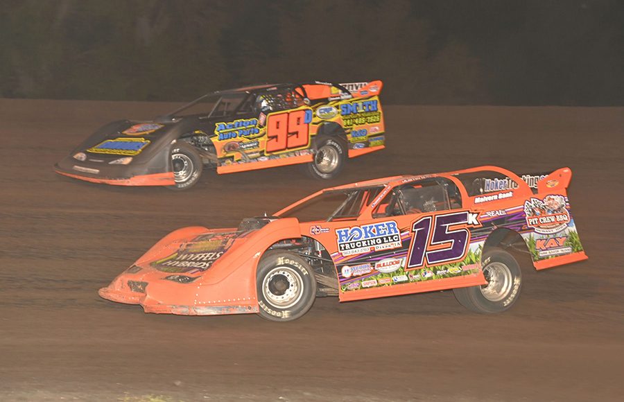 Justin Kay (15k) races under Darrel DeFrance during Monday's IMCA Speedway Motors Super Nationals late model championship feature at Boone Speedway. (Tom Macht Photo)