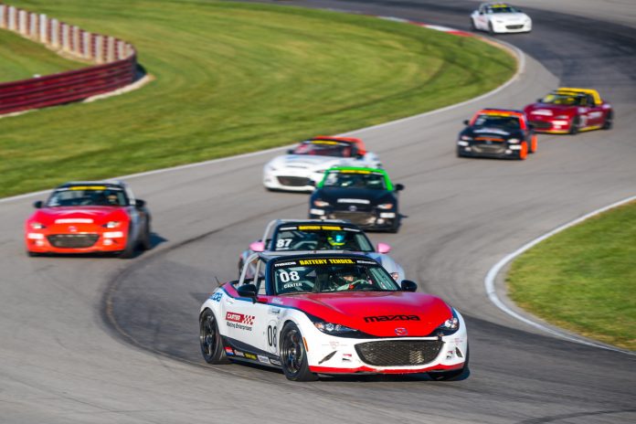 Michael Carter leads the field during Saturday's Global Mazda MX-5 Cup event at the Mid-Ohio Sports Car Course. Michael Carter leads the field during Saturday's Global Mazda MX-5 Cup event at the Mid-Ohio Sports Car Course.