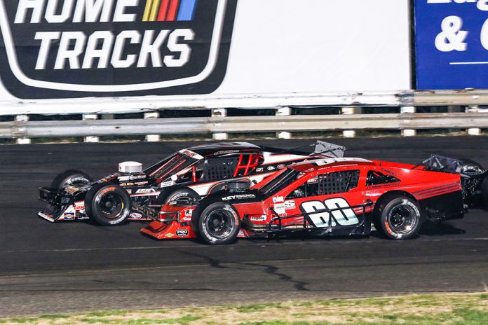 Matt Hirschman (60) battles Chase Dowling during Saturday's Tri Track Open Modified Series race at Stafford Motor Speedway. (Dick Ayers Photo) Matt Hirschman (60) battles Chase Dowling during Saturday's Tri Track Open Modified Series race at Stafford Motor Speedway. (Dick Ayers Photo)