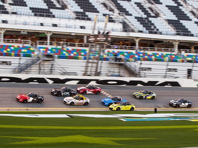 Gresham Wagner takes the checkered flag ahead of the pack to win Thursday's Mazda MX-5 Cup opener at Daytona Int'l Speedway. Gresham Wagner takes the checkered flag ahead of the pack to win Thursday's Mazda MX-5 Cup opener at Daytona Int'l Speedway.