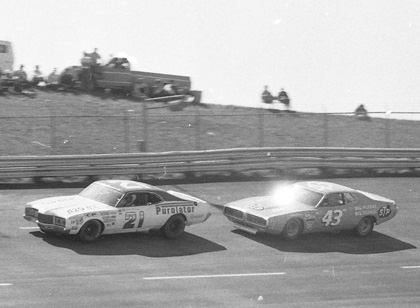 David Pearson Richard Petty David Pearson (21) makes a move around the slower car of Richard Petty.