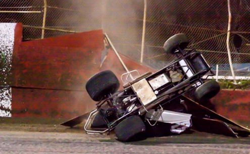 Shawn Murray's car lands back in the speedway after nearly exiting the track through the fence. (R.E. Wing Photo)