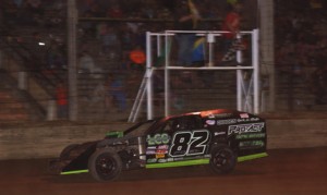 Jacob Poel crosses the finish line to win Monday's DIRTcar UMP modified Firecracker 50 at Shadyhill Speedway. (Gary Gasper Photo)