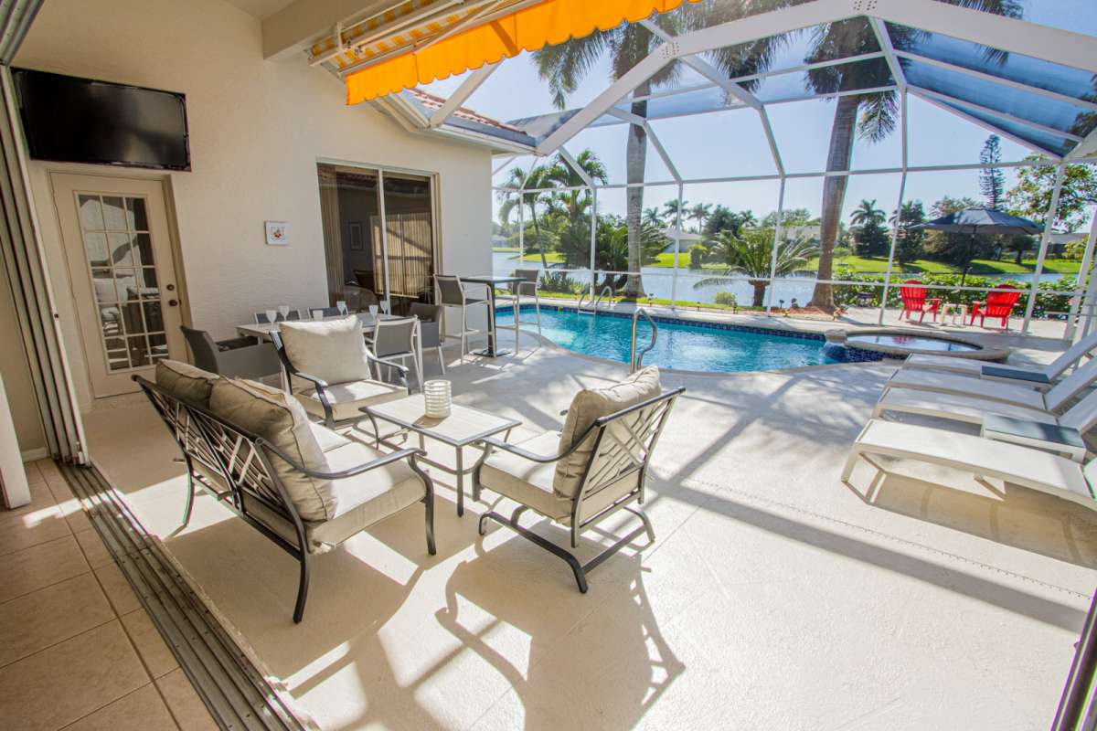 Naples Vacation Rental Briarwood lake views, pool/spa home w/awning, extended deck