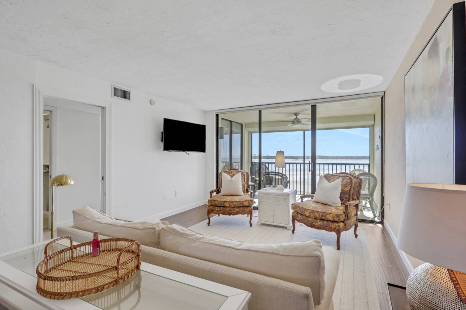 A wall mounted Smart TV with DirecTV programming is located in the living room; guests will need their own logins for subscription based channels. (Pic)