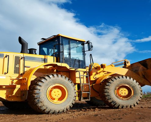 Serving the construction industry, heavy construction loader bulldozer at construction area