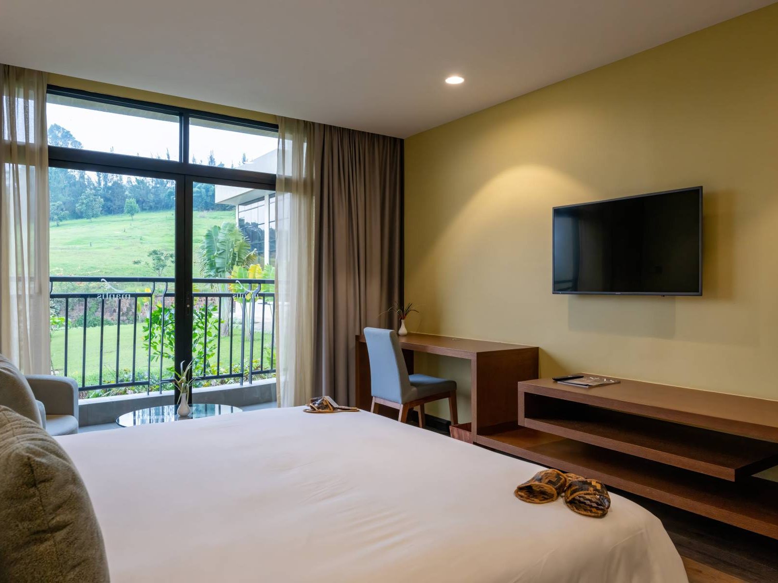 Guest bedroom and lake-view balcony at Mantis Kivu Marina