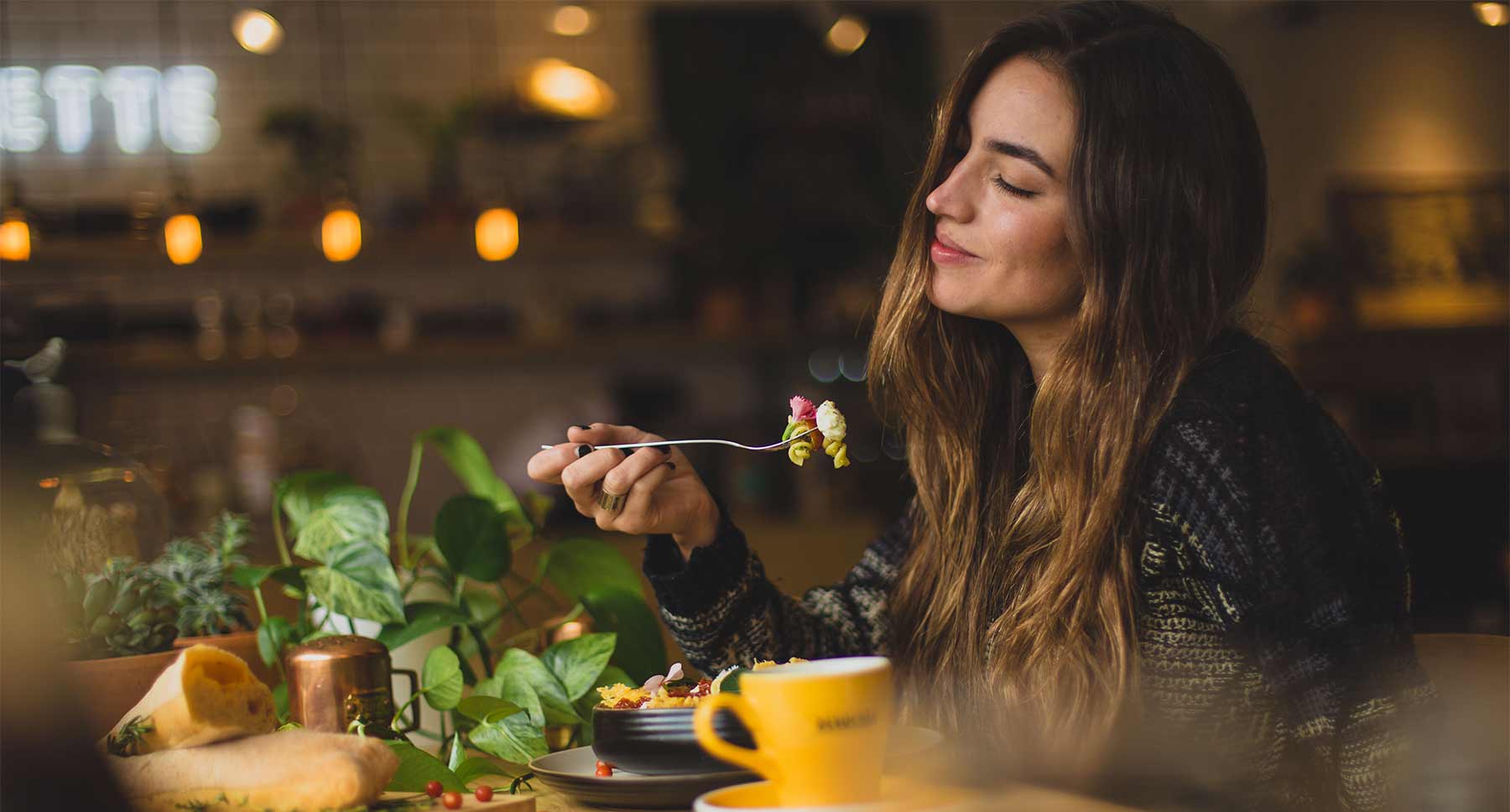 photo of woman eating dinner