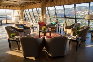 Photo of Sunlit seated lounge area for photoshoot with city scape