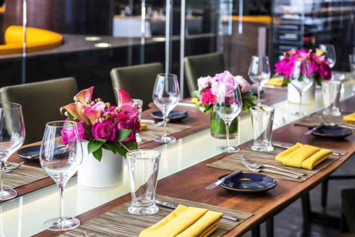 Photo of table setup with flowers and glasses