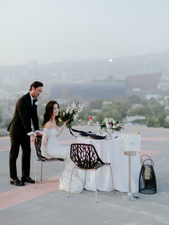Photo of a couple on the helipad seating a dining table for a proposal