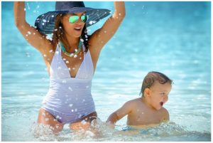 Family photo splashing in the pool