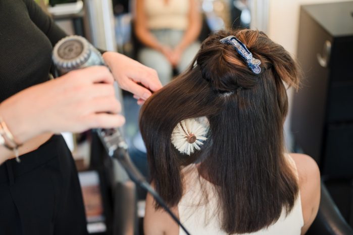 Photo of guest having hair styled