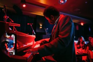 Photo of a pianist playing on stage