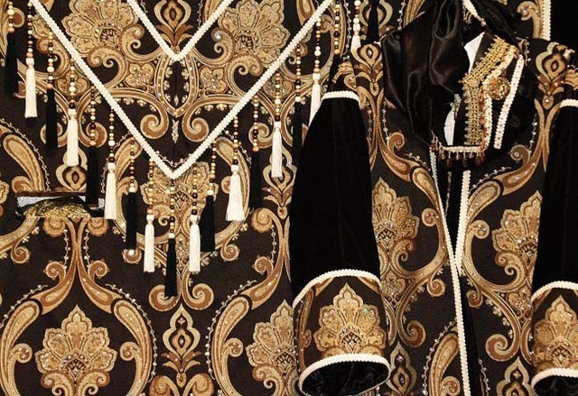 Costumes Close Up - A close up of some of the fabrics and trimmings on a native costume.