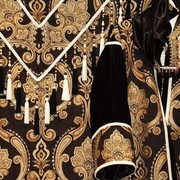 Costumes Close Up - A close up of some of the fabrics and trimmings on a native costume.