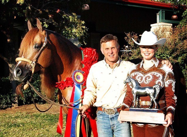Tommy Garland and Natalie Hunt with Resstitution - Tommy Garland and his client Natalie Hunt with her horse Resstitution take time to celebrate their National Championship win in the Western Pleasure AAOTR Maturity. Congratulations!