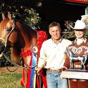 Tommy Garland and Natalie Hunt with Resstitution - Tommy Garland and his client Natalie Hunt with her horse Resstitution take time to celebrate their National Championship win in the Western Pleasure AAOTR Maturity. Congratulations!