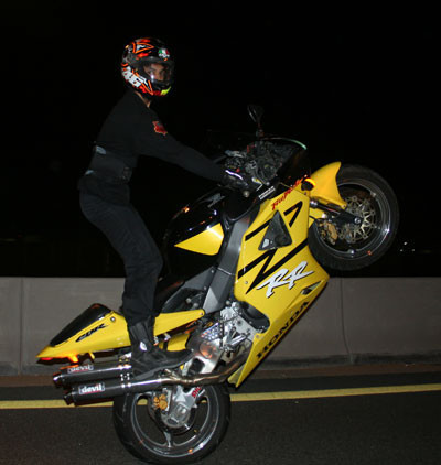Dubai Day 5 - Someone showing off on hismotor cycle for us on the Dubai highway
