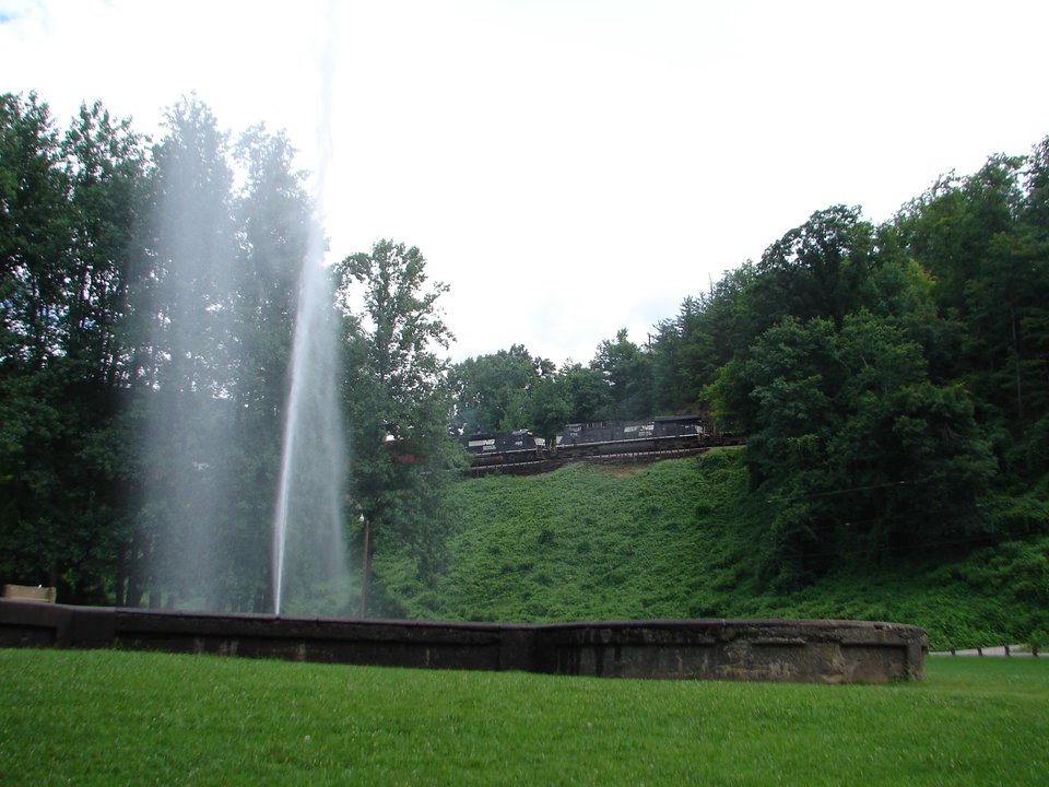 geyser with train passing