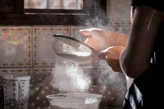 sifting flour - Unsplash.com