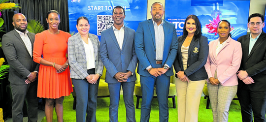 Nigel Edwards, executive director, Unit Trust Corporation and director, UTC GBFL, fourth from left, stands with his UTC colleagues Deyson Scott, chief sales and marketing officer, left; Natasha Davis, chief operations officer; Crystal Rodriguez-Greaves, chief investment officer, Edwards; Omar Burch Smith, regional collective scheme manager (CIS), UTC Fund Management Services STL Ltd; Hema Ramkissoon, head of marketing; Deesha Lewis, regional investment adviser, UTC Fund Management Services STL Ltd, and Andrew Maharaj, investment research and strategy manager. PHOTO COURTESY UTC